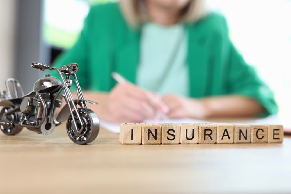 Motorcycle insurance adjuster in her office