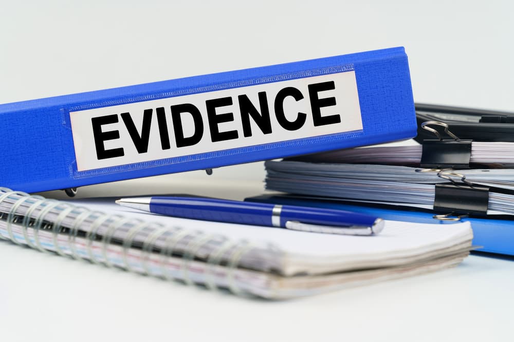 A blue color box file labeled Evidence
