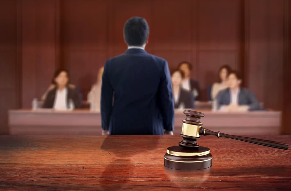 Judicial wooden table in courtroom front of the lawyer talk to jury on courtroom