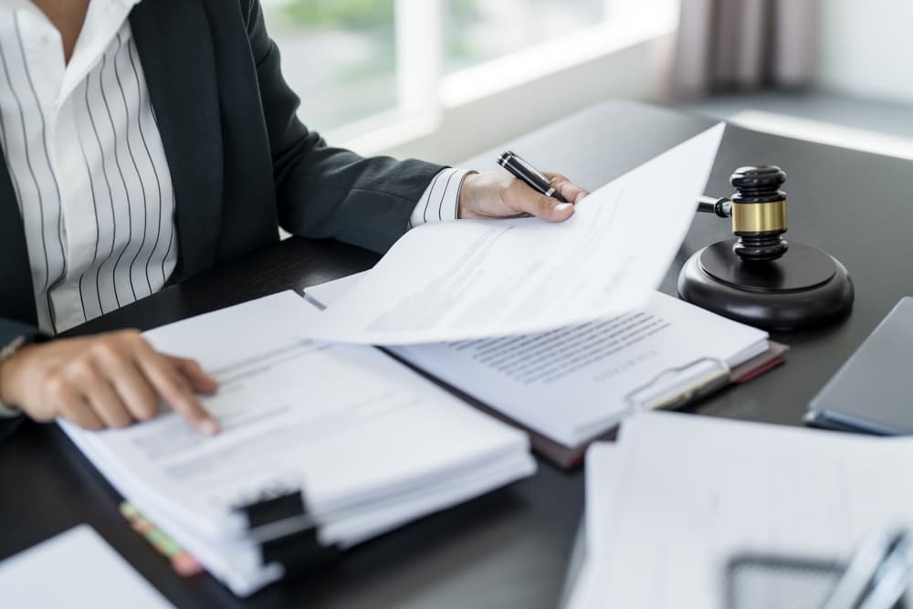 Wrongful Death Lawyer working with case file